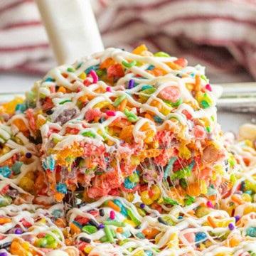 Spatula with slice of fruity pebble rice crispy treat.